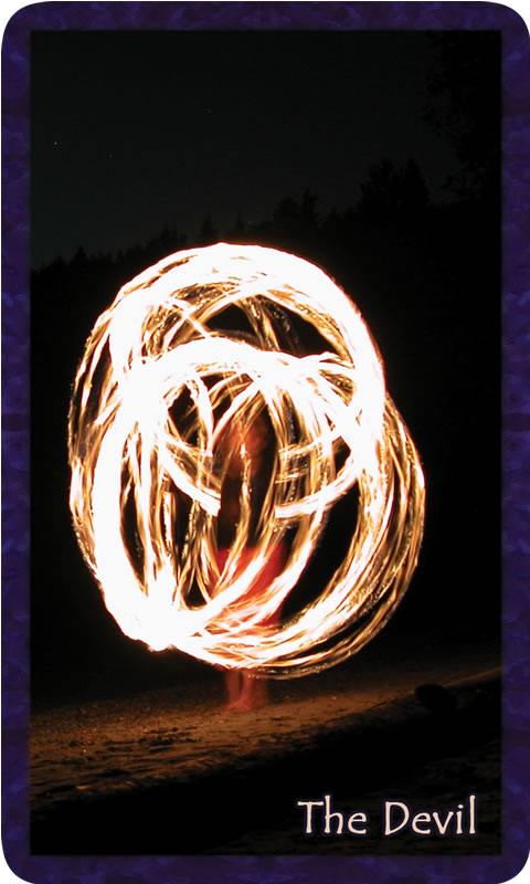 Photo of fire spinner in the dark of night. Gratitude Tarot card The Devil: do you feel it? will you dance in the light of your truth's brilliance?