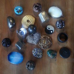 Some of the weights available for Shaman's Whisper Pendulums as of December 6, 2013: dyed agate, clay flower, butterfly stamped turquoise, metal wire wrap balls, filigree heart, copper wire wrapped green stone, and more!