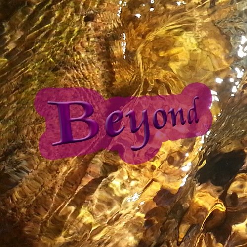 Macro photo of rippling golden water, overlaid with my word of the year in my other colour of the year: Beyond.