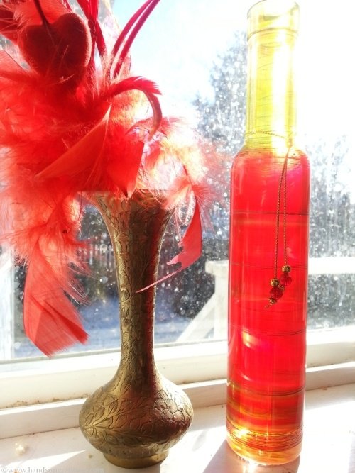 The bottle to commemorate Diva dog, on the sill in front of my dirty sunny kitchen window, beside the Valentine's Hearts from John.